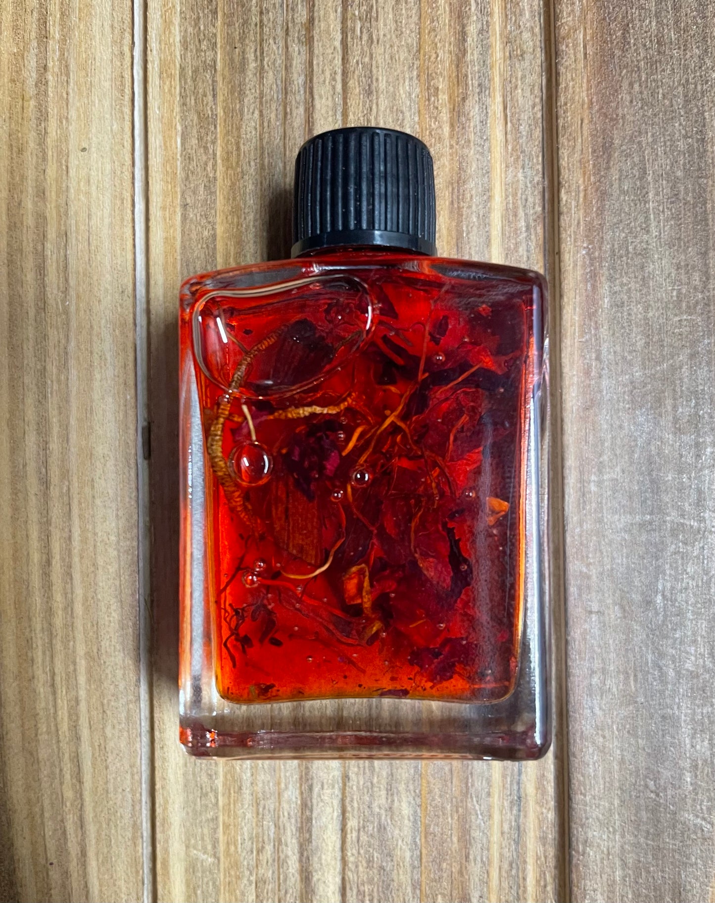 Dixie John Oil - A conjure oil of love, passion, and family