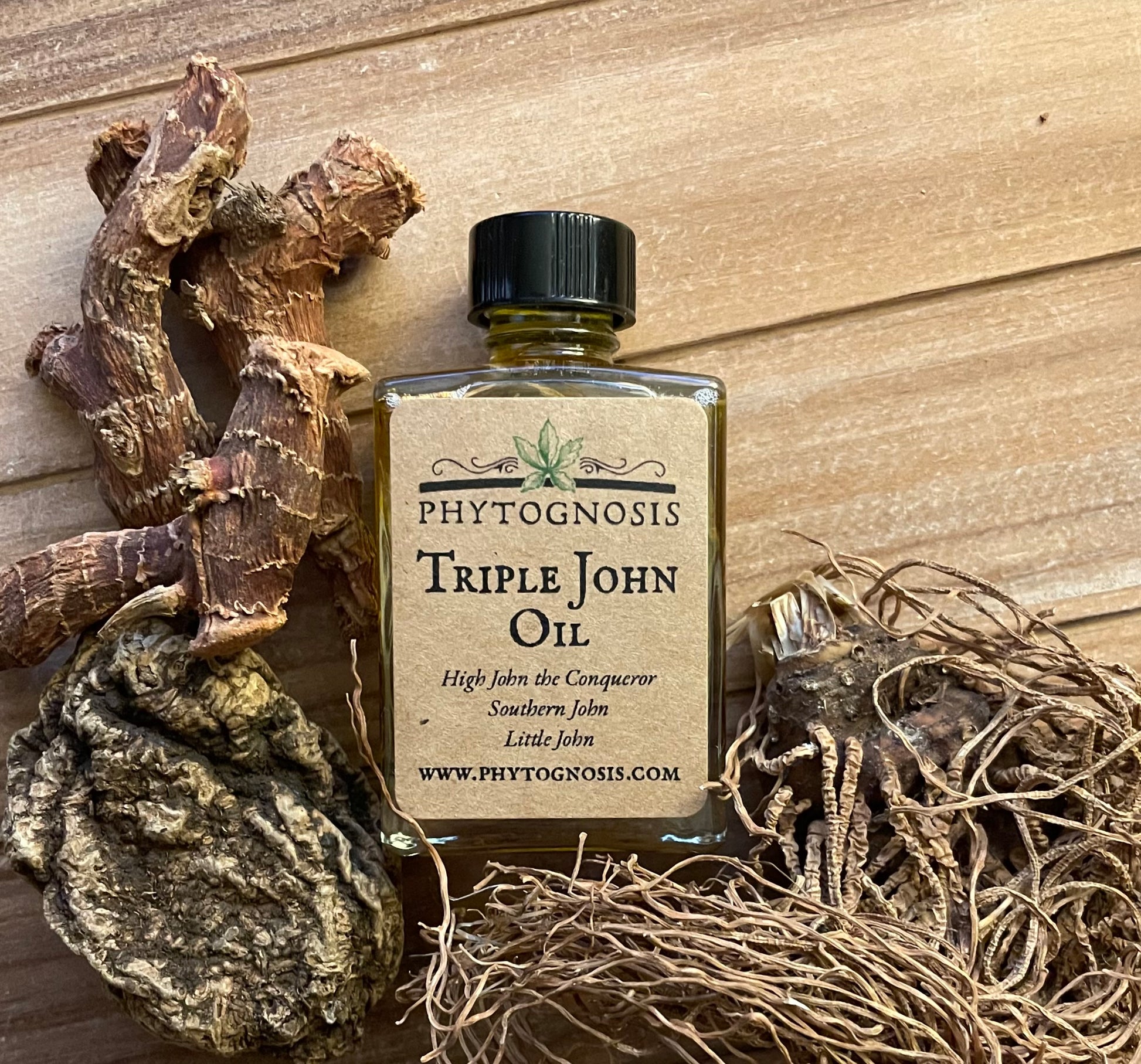 Triple John Oil 30mL clear glass bottle with black cap containing amber-colored hoodoo conjure oil made with High John the Conqueror, Little John to Chew, and Southern John roots