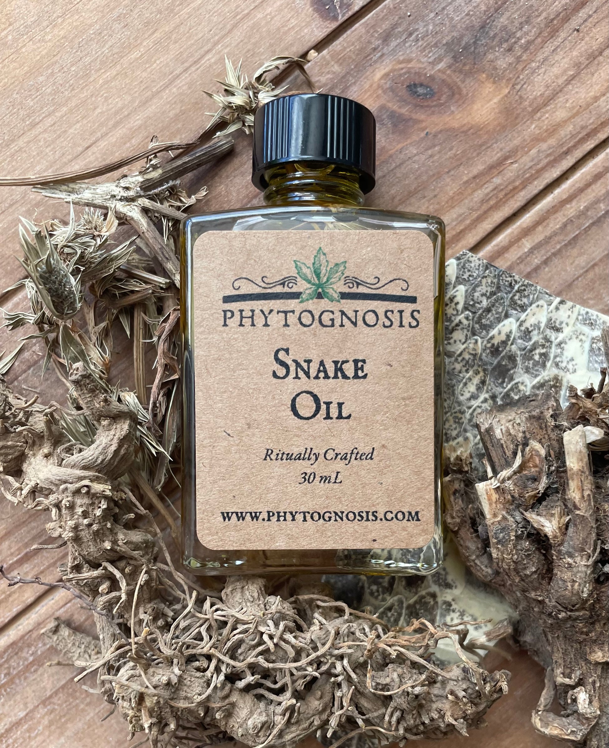 Snake Root Oil bottle - traditional hoodoo protection formula with four snake-themed roots in jojoba oil, 1 oz