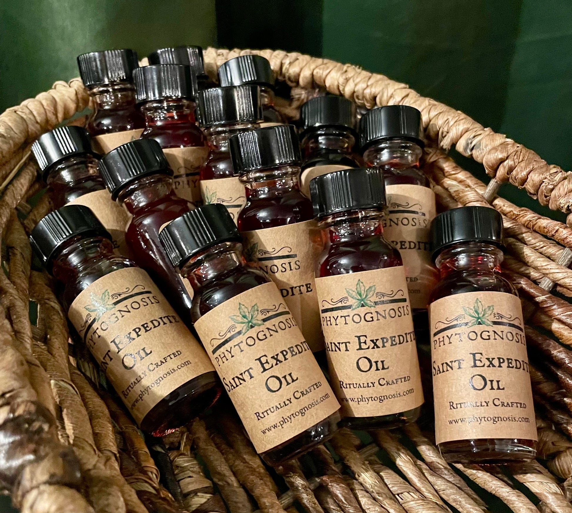 Saint Expedite ritual oil 15ml bottle with lodestone and botanical inclusions in dyed jojoba oil