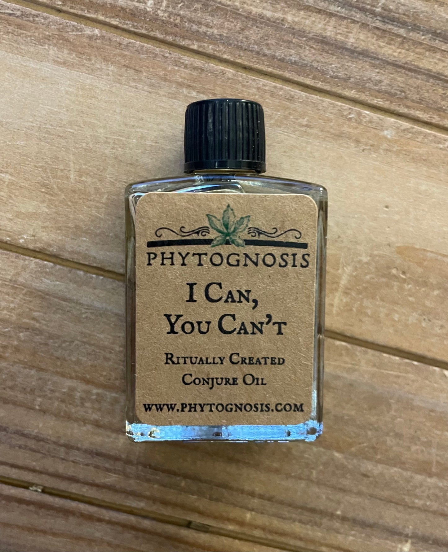 Small bottle with a label on a wooden surface