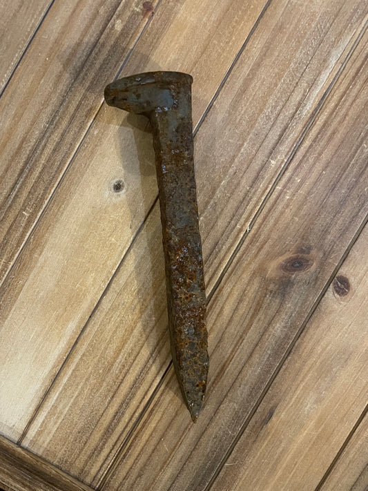 Single rusty railroad spike for Hoodoo property line protection and warding, traditional American folk magic curio
